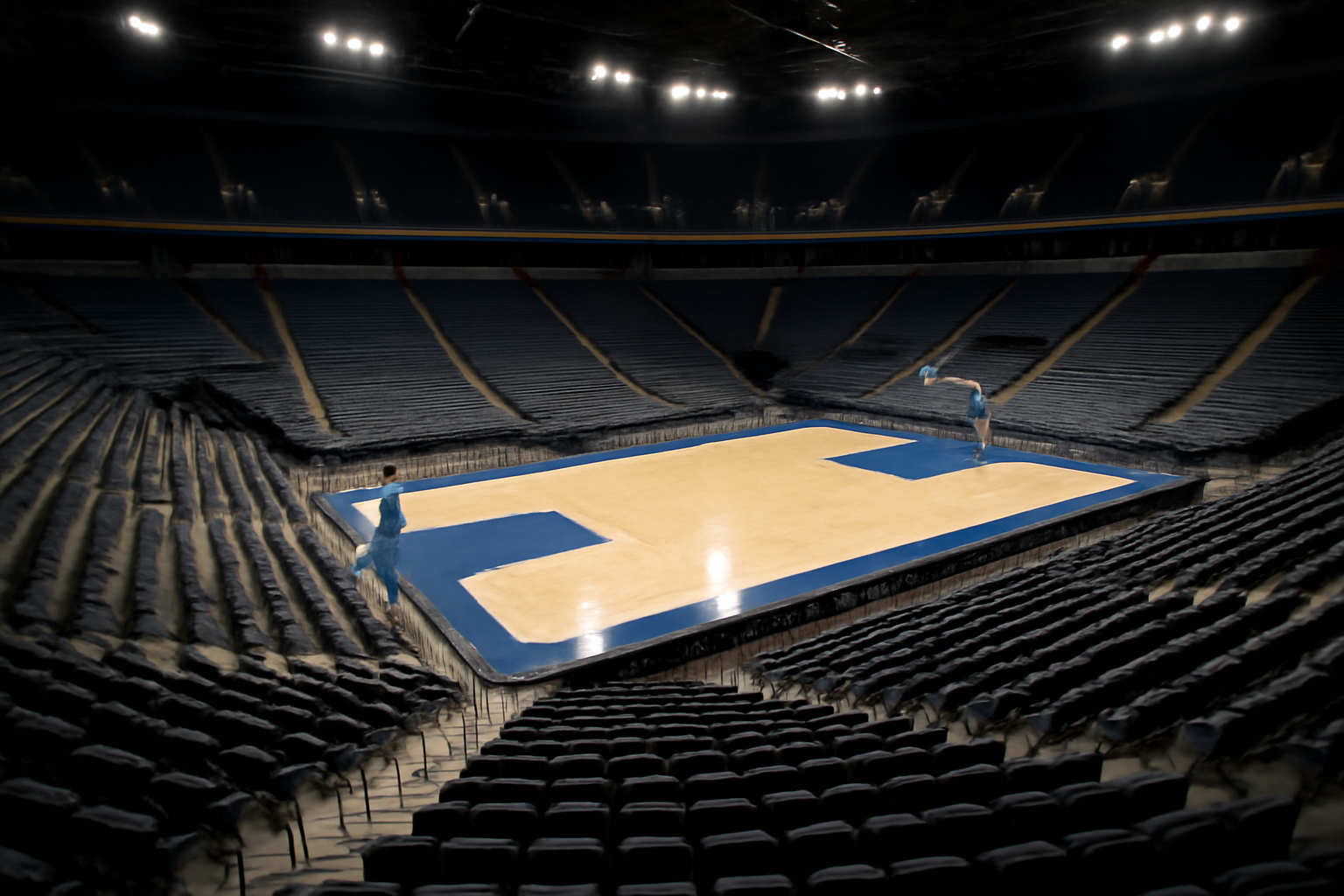 Empty WNBA arena seating bowl with a basketball court visible under bright overhead lights