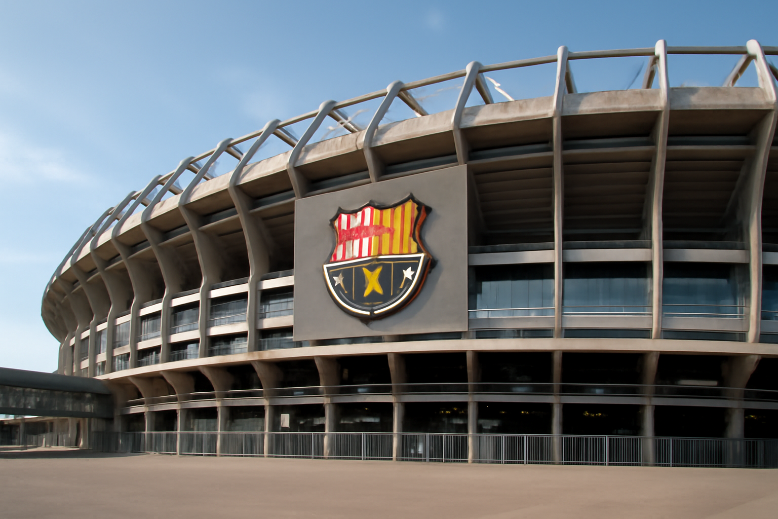 Real Madrid's Santiago Bernabéu stadium exterior under daylight with the club crest visible
