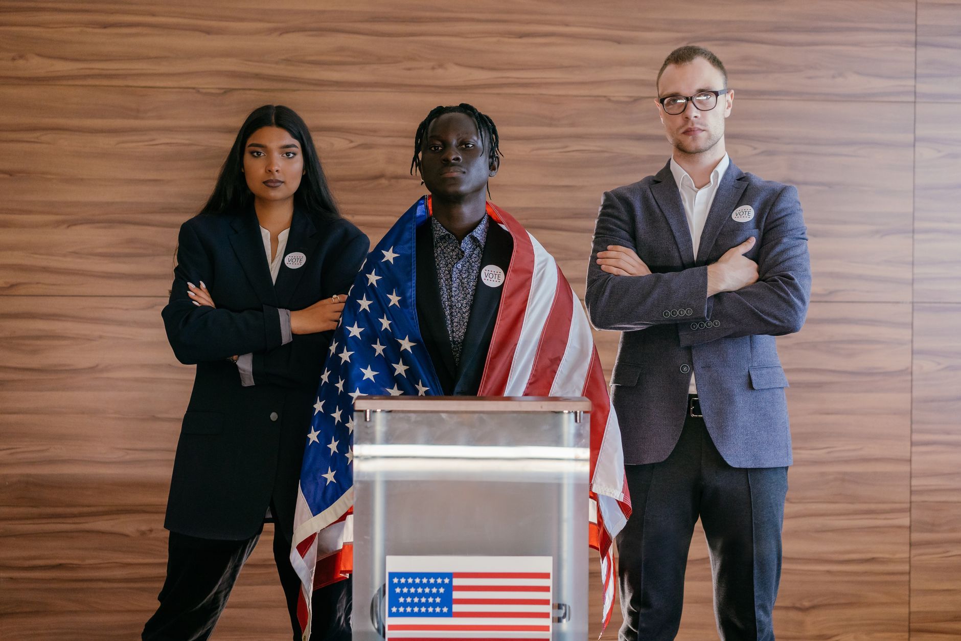 Two lecterns on a debate stage with Iowa state flags in the background